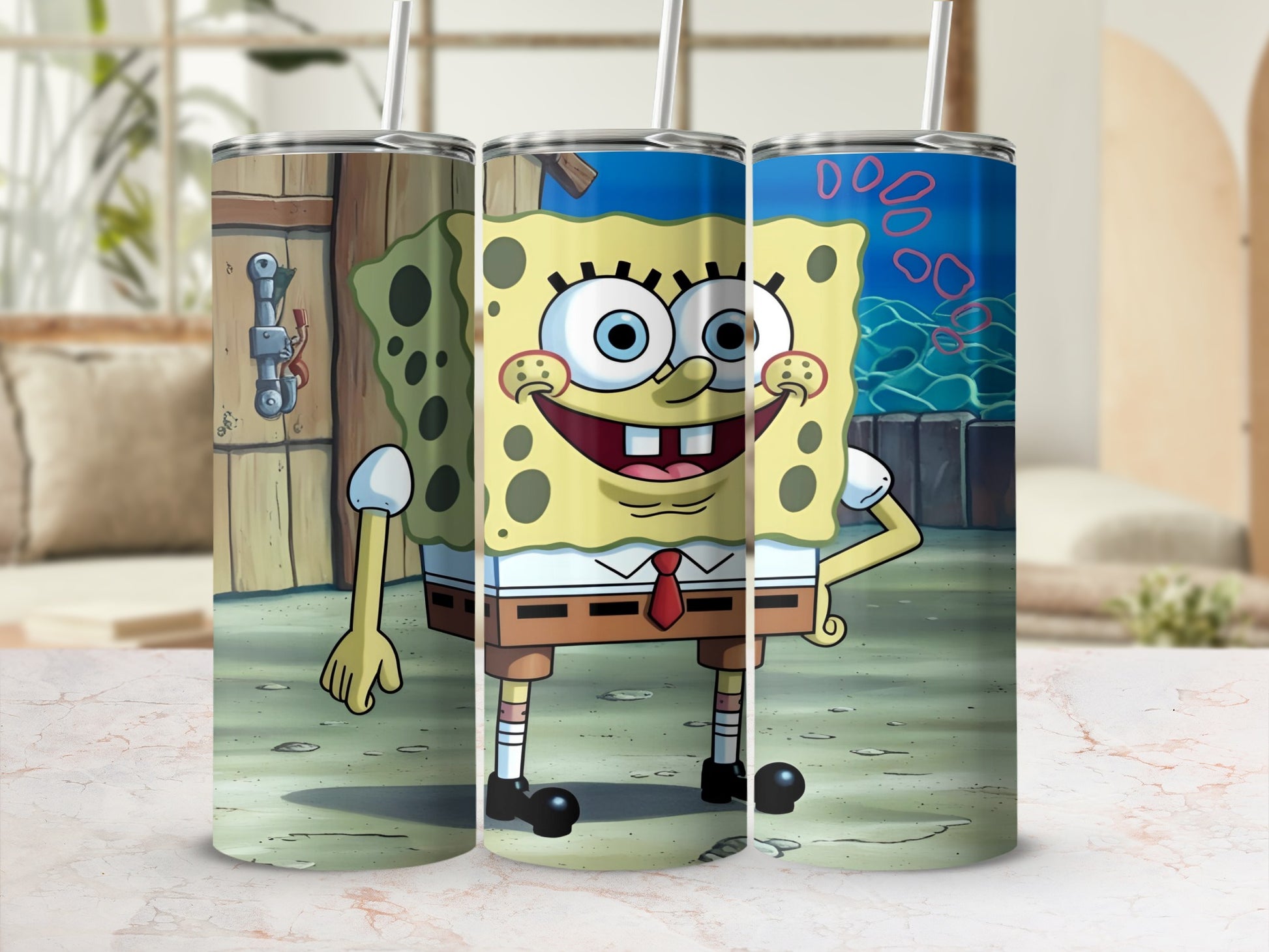 SpongeBob SquarePants character on three tumbler cups with straws.