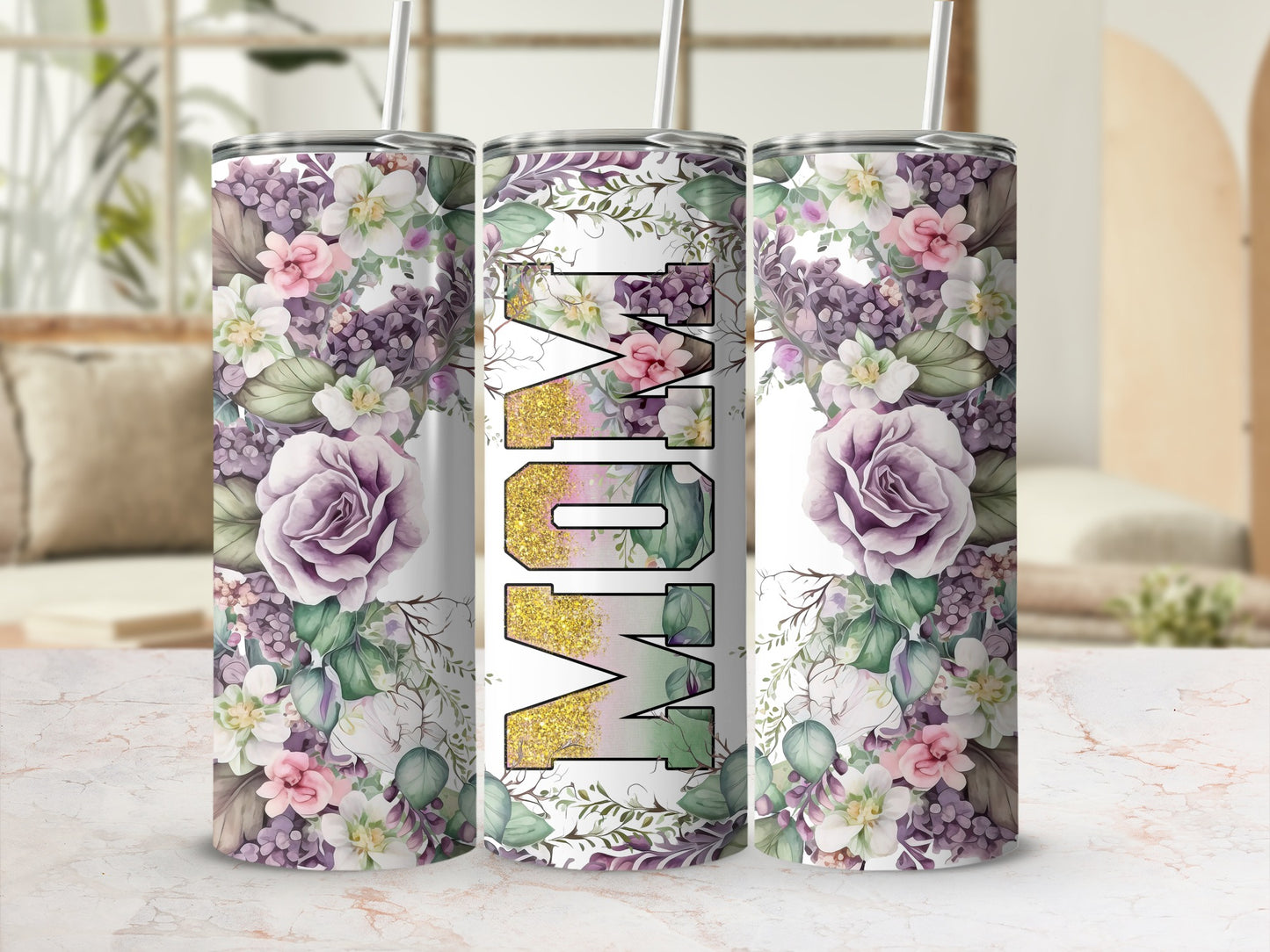 Floral tumbler with "Mom" in glittery gold text.