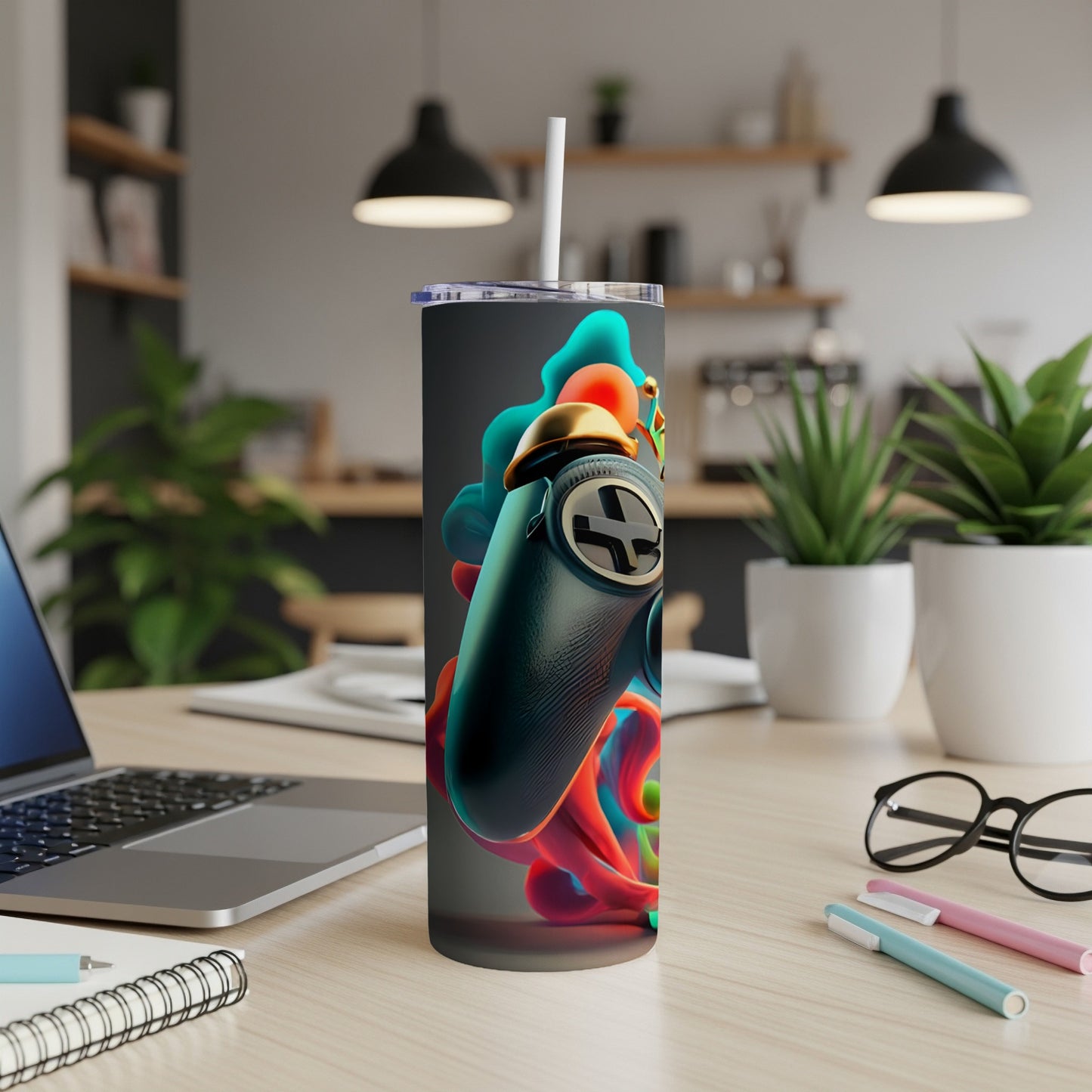 Gaming controller with colorful abstract design on a travel tumbler.