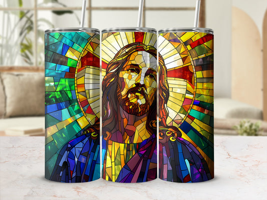 Jesus stained glass art on three tumblers with straws, on a countertop.