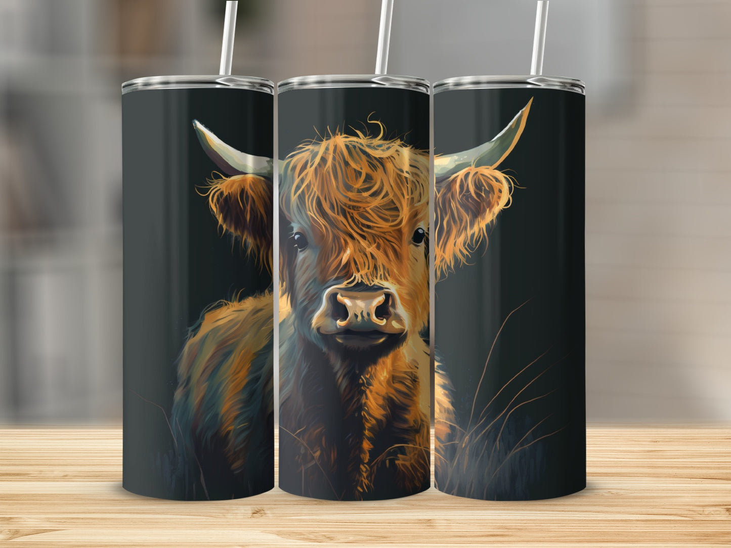 Highland cow illustration on three stacked tumblers.