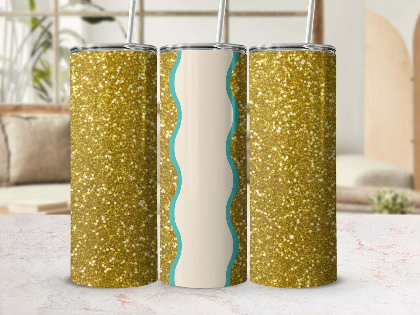 Three gold glitter tumblers with teal wavy accents on a marbled surface.
