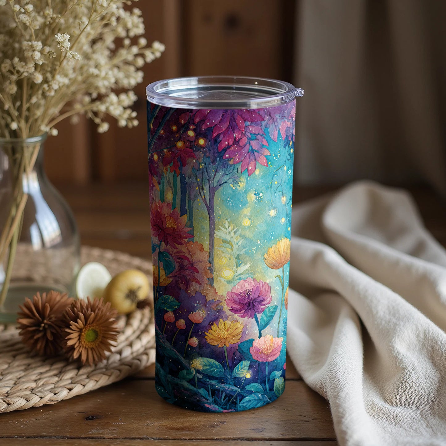 Vibrant forest and flowers art on colorful tumbler