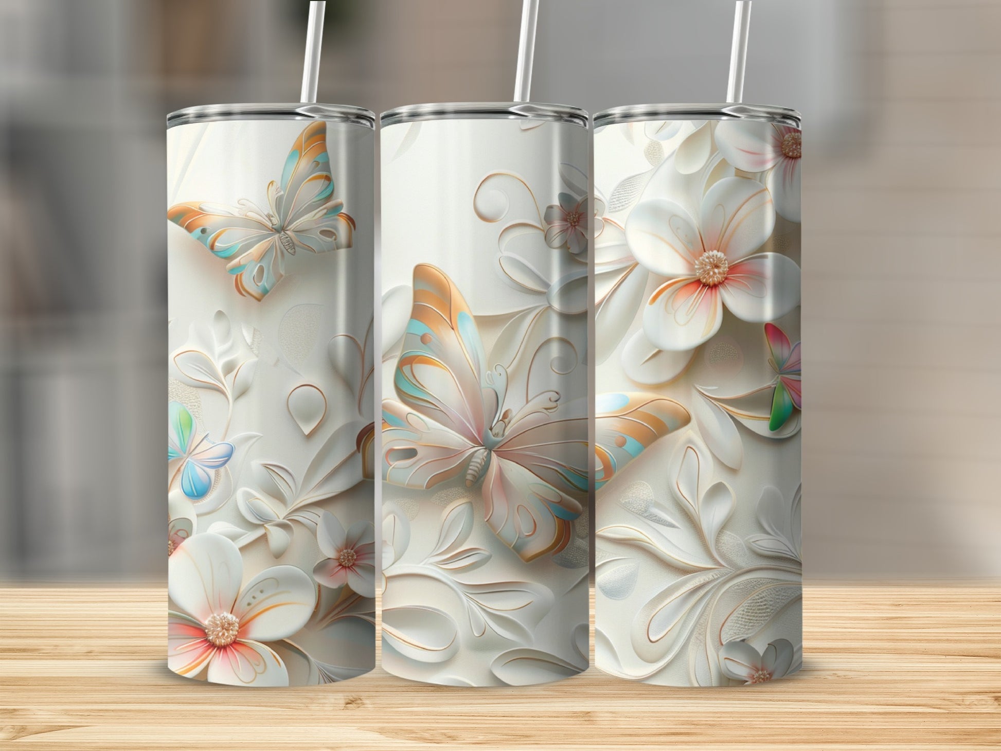 White tumblers with butterfly and floral embossed designs.