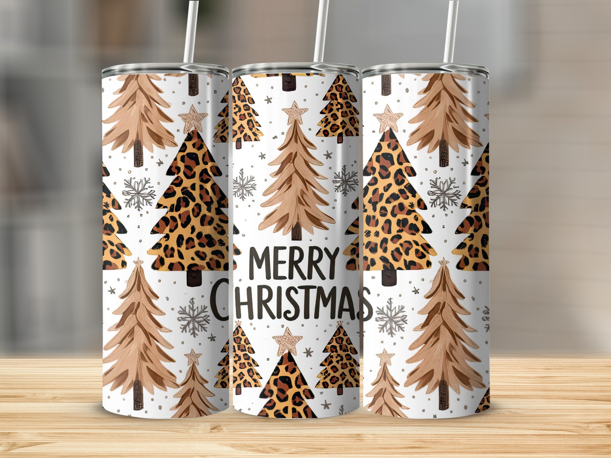 Three tumblers with Christmas trees and leopard print patterns.