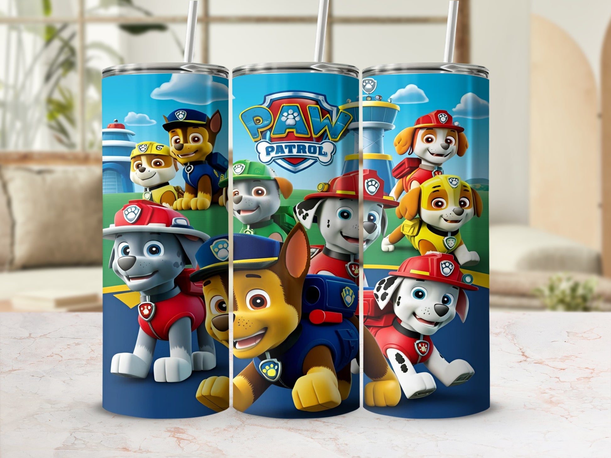 Paw Patrol characters on a blue tumbler with yellow trim and straw.