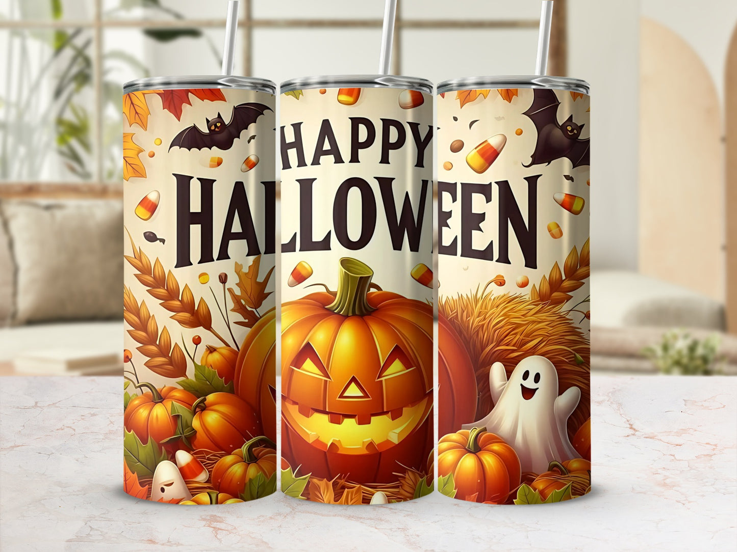 Three Halloween tumblers with pumpkins, bats, ghosts, candy corn, and autumn leaves.