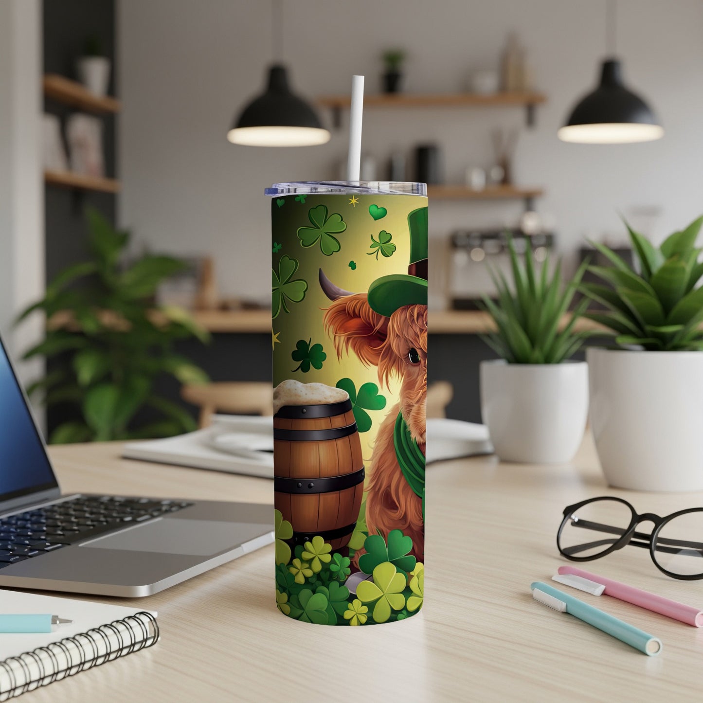 Highland cow in green hat with shamrocks and beer barrel on St. Patrick's Day tumbler.
