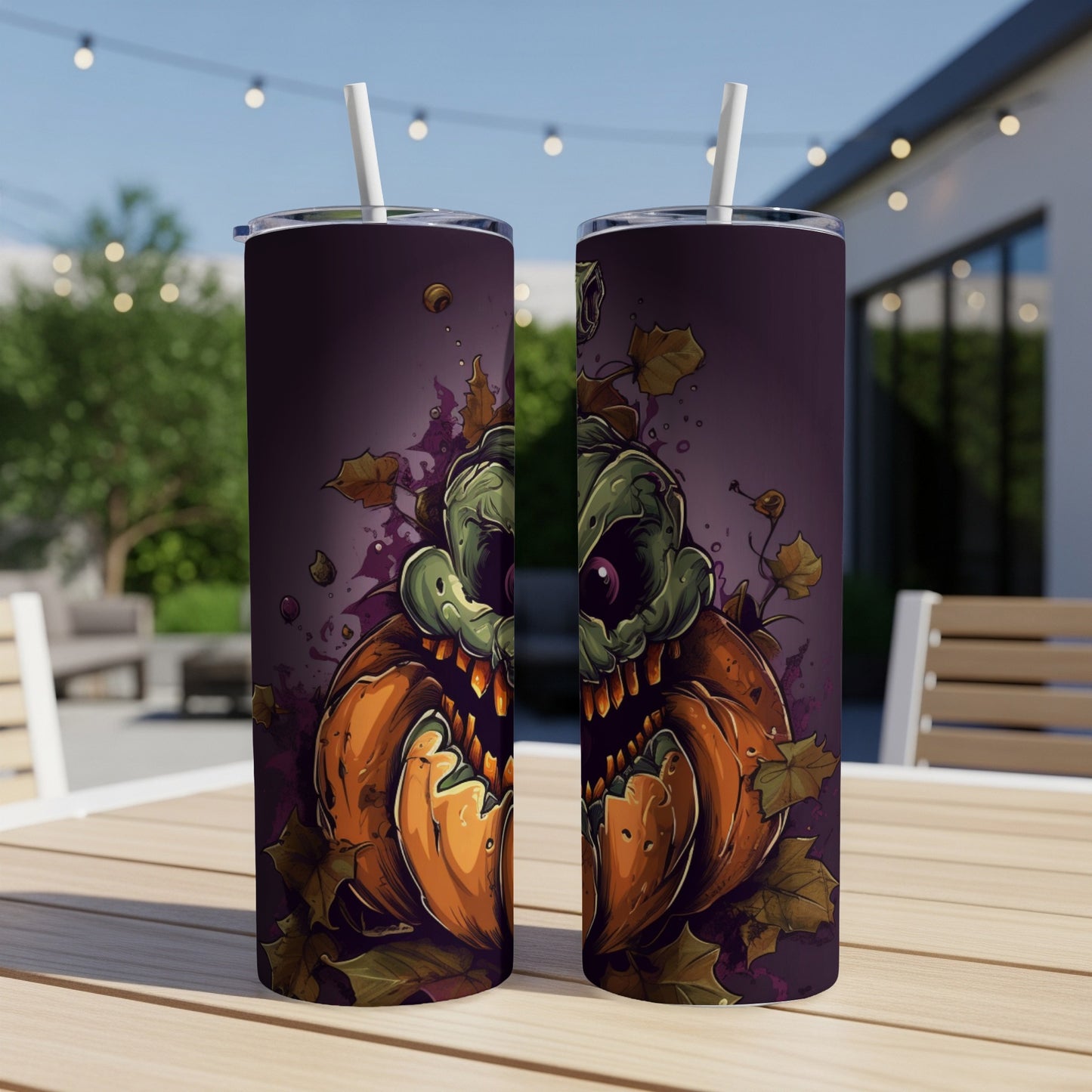 Two tumblers featuring a spooky carved pumpkin and green monster Halloween design.