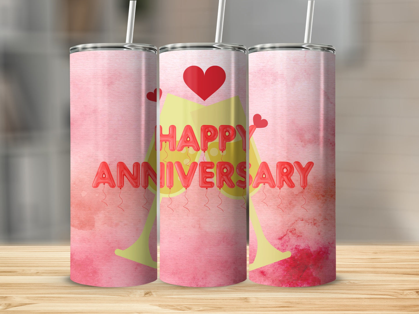 Pink watercolor tumbler with "Happy Anniversary" in balloon letters.