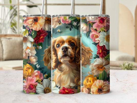 Cavalier King Charles Spaniel surrounded by colorful flowers on a floral tumbler.