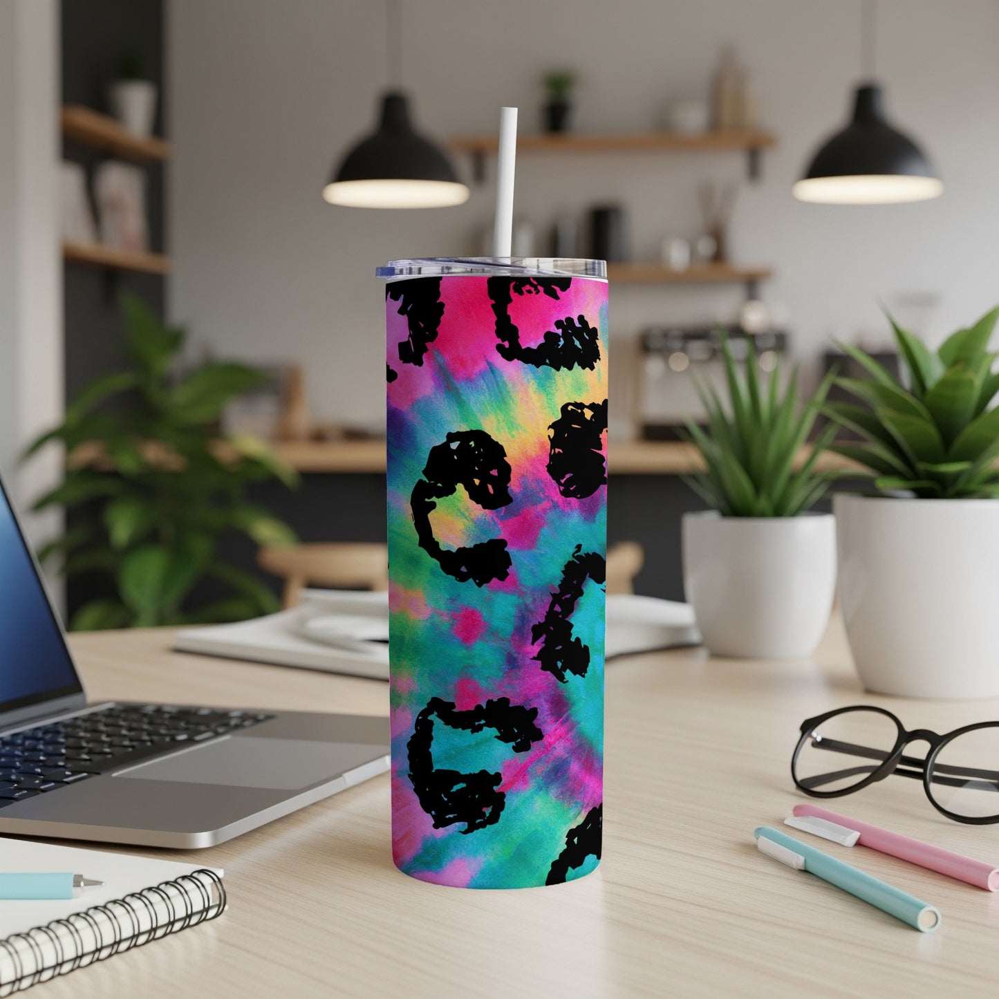 Tumbler with pink, blue, and green tie-dye pattern and black leopard print accents.