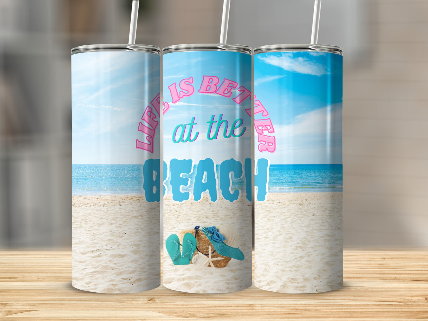 Tumbler with "Life is better at the beach" text and beach scene.