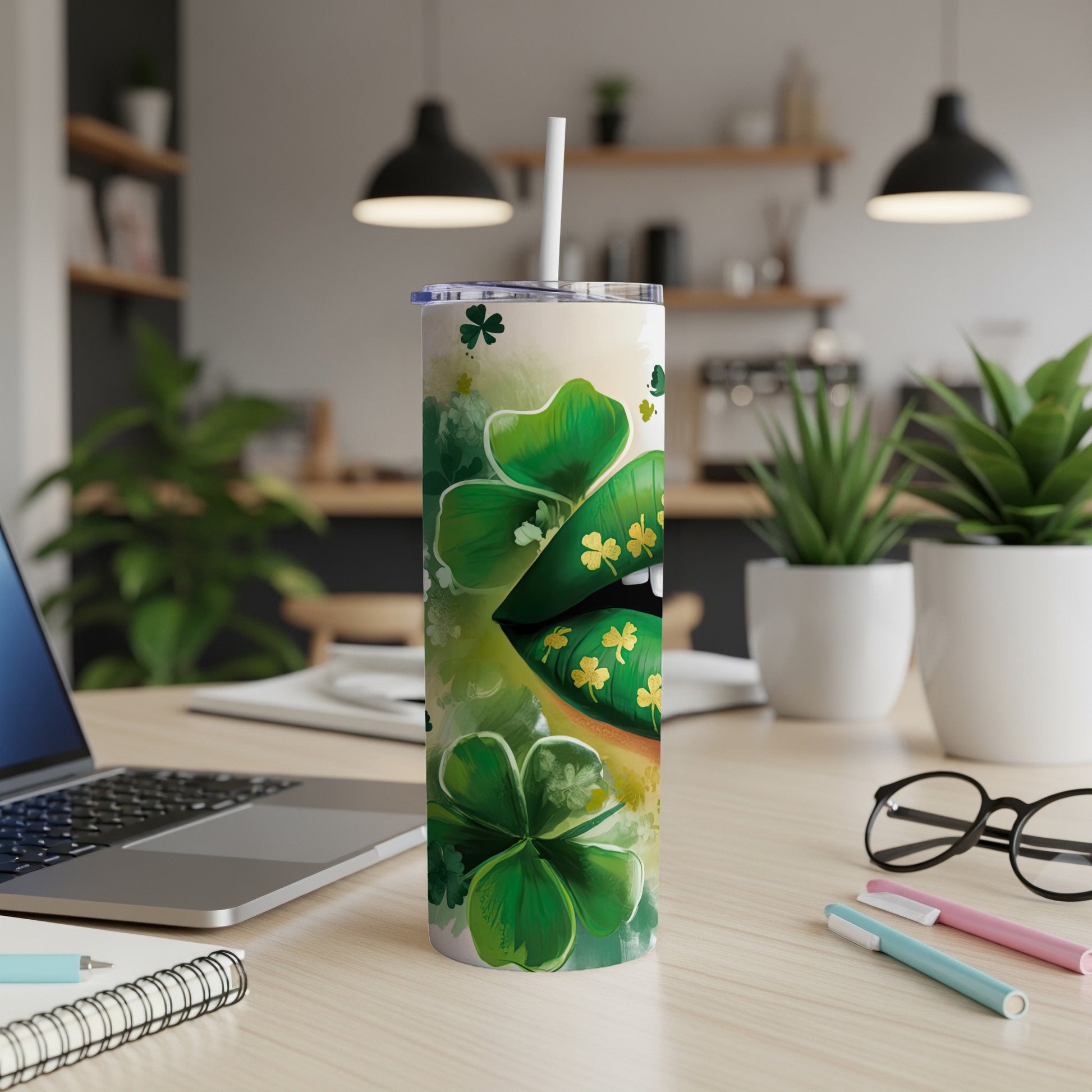 Green lips with shamrocks and gold accents on a tumbler with a straw.