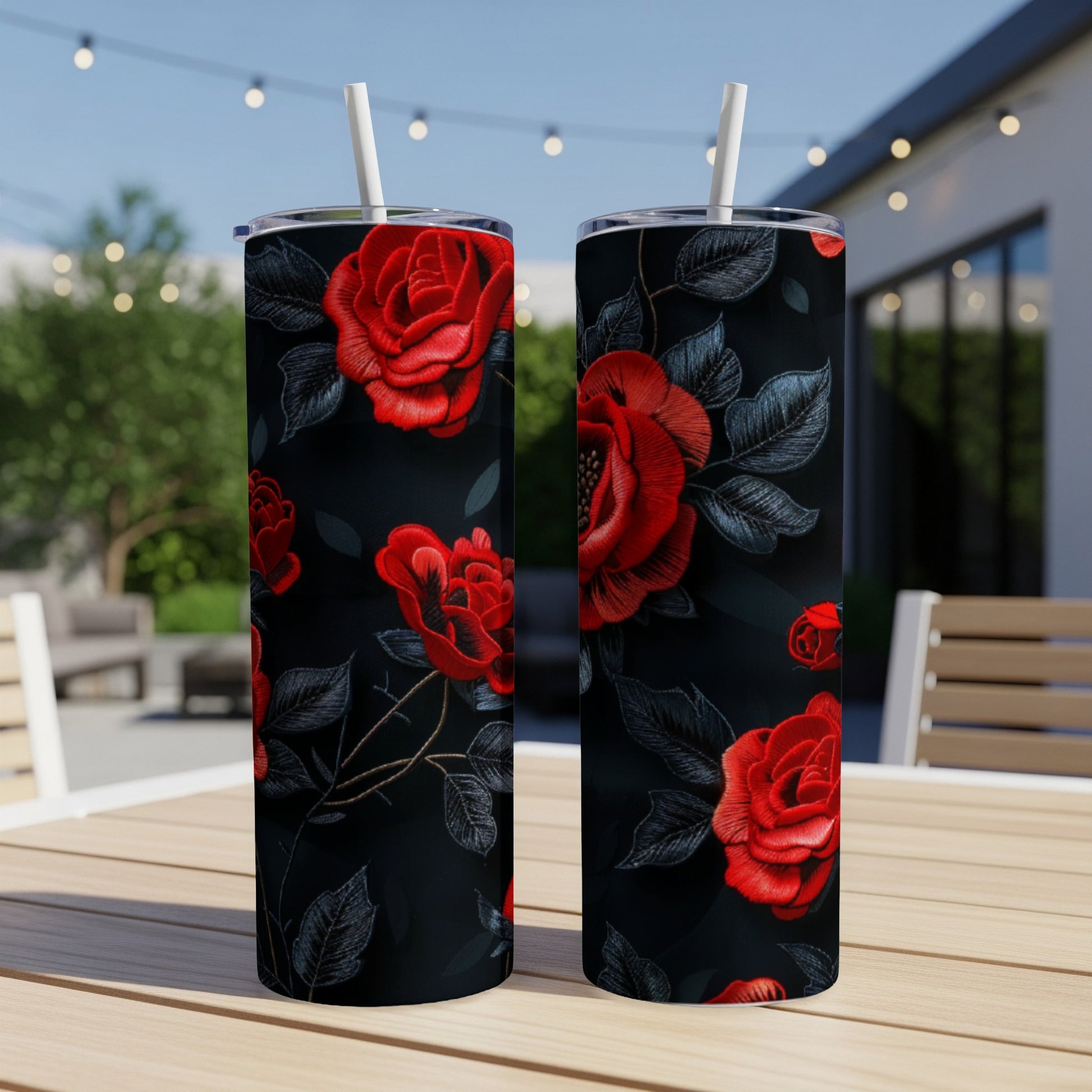 Two tumblers with a black background and a red rose floral pattern.