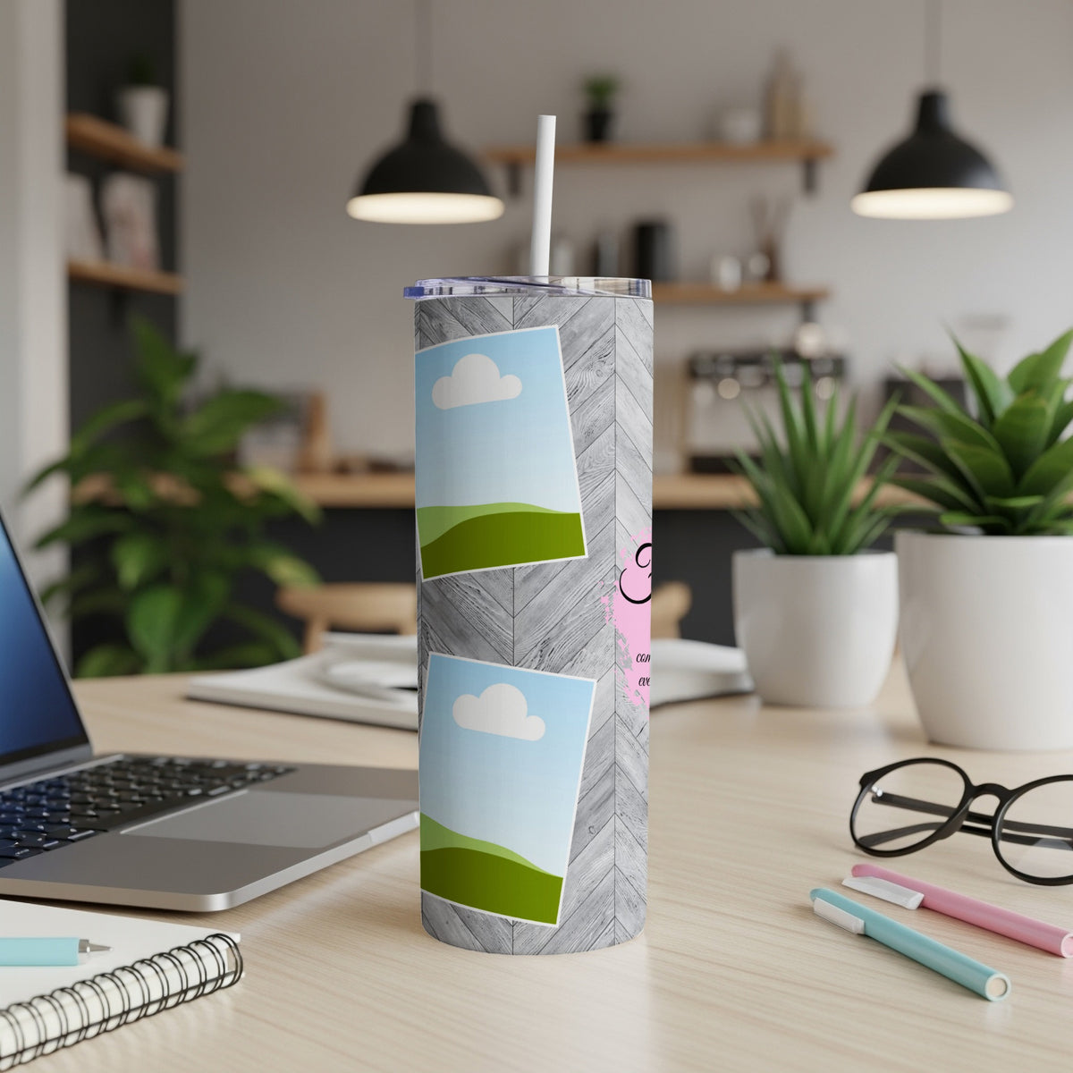 Tumbler with wood grain pattern, clouds, and text on pink background.