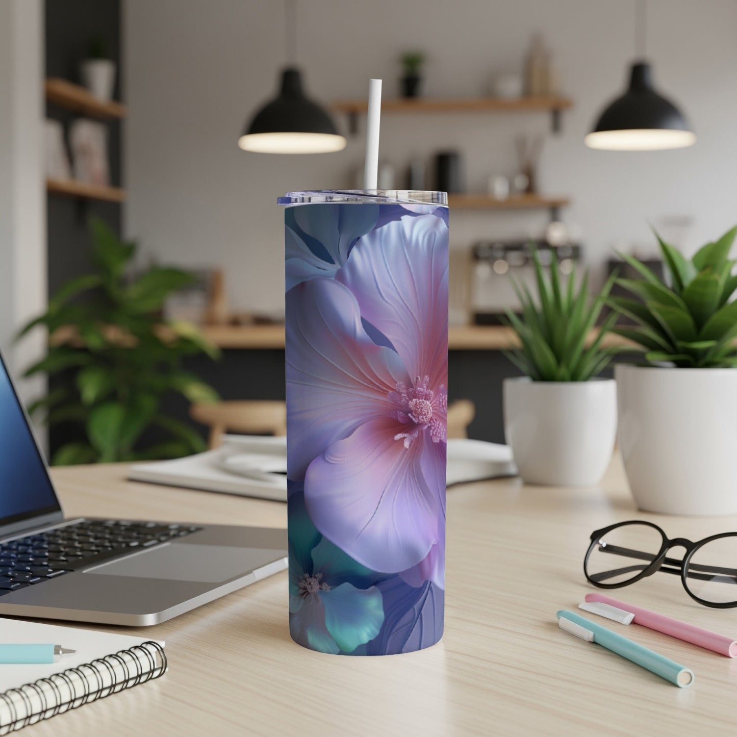 Tumbler with large purple and pink floral design, with white straw.