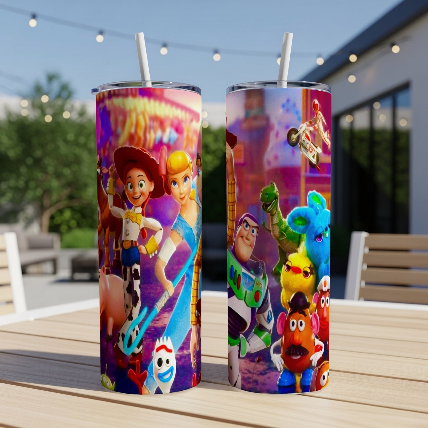 Toy Story characters on two tumblers with straws, set on a table outdoors.