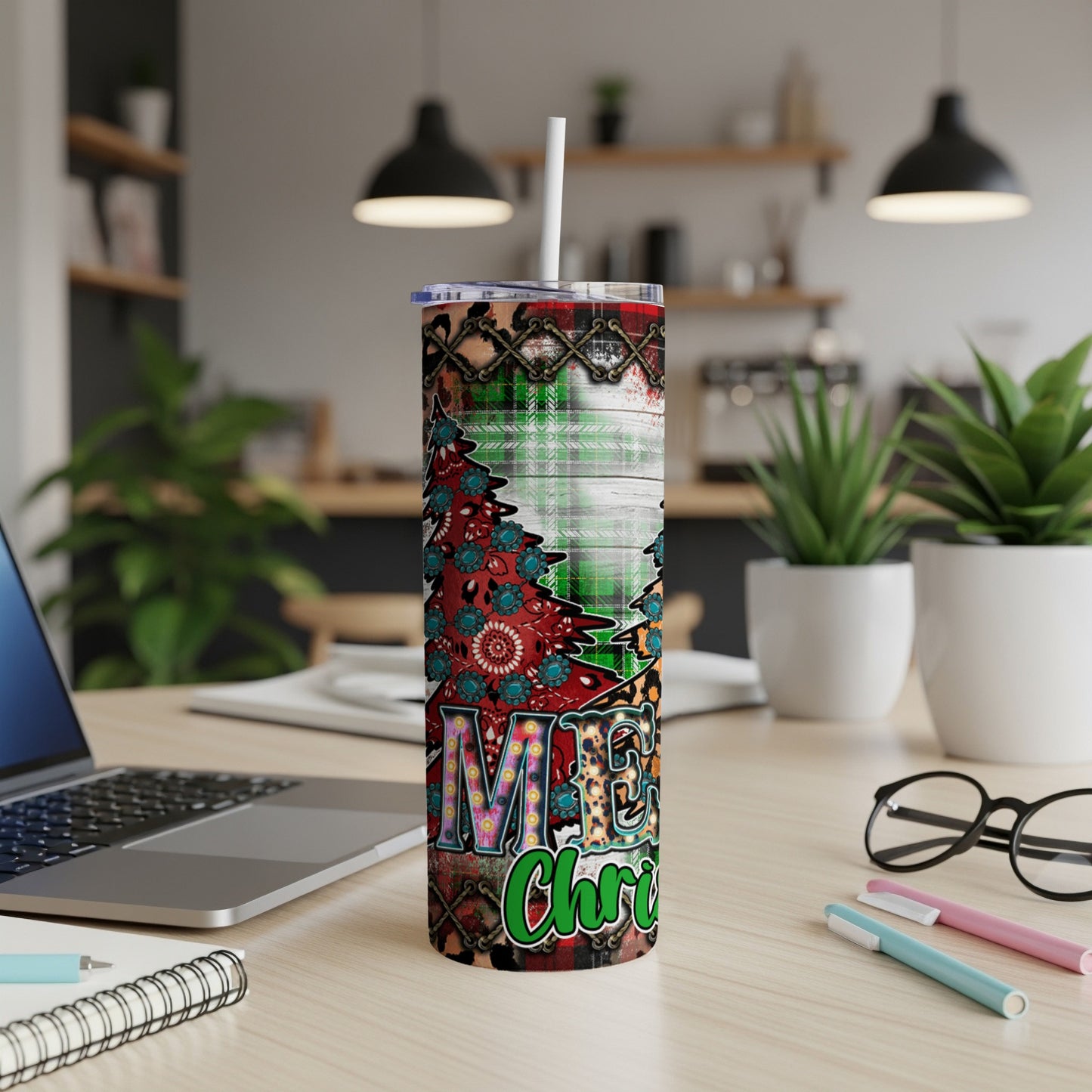 Merry Christmas tumbler with plaid and floral patterns.