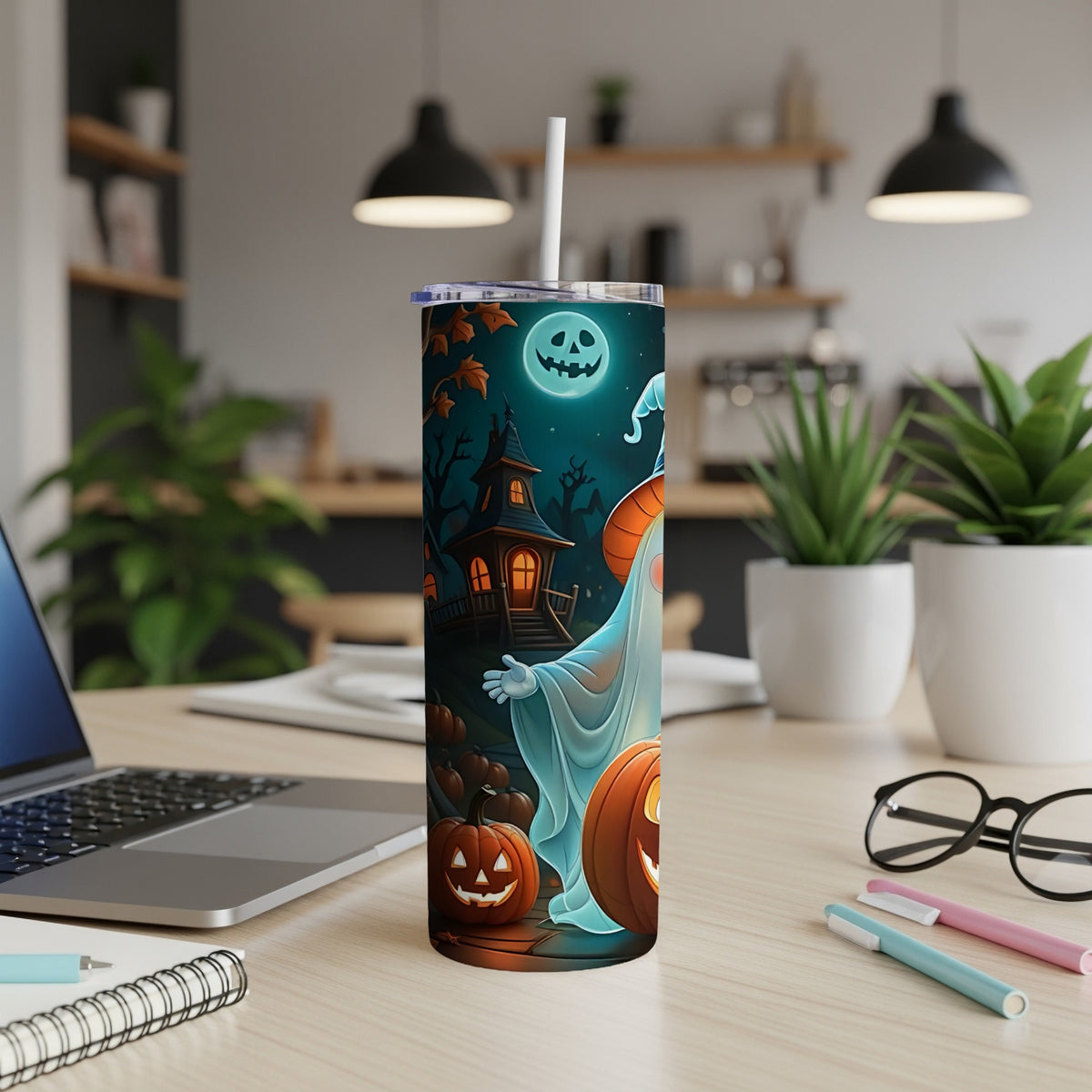 Halloween tumbler with ghost, pumpkins, and haunted house graphic.