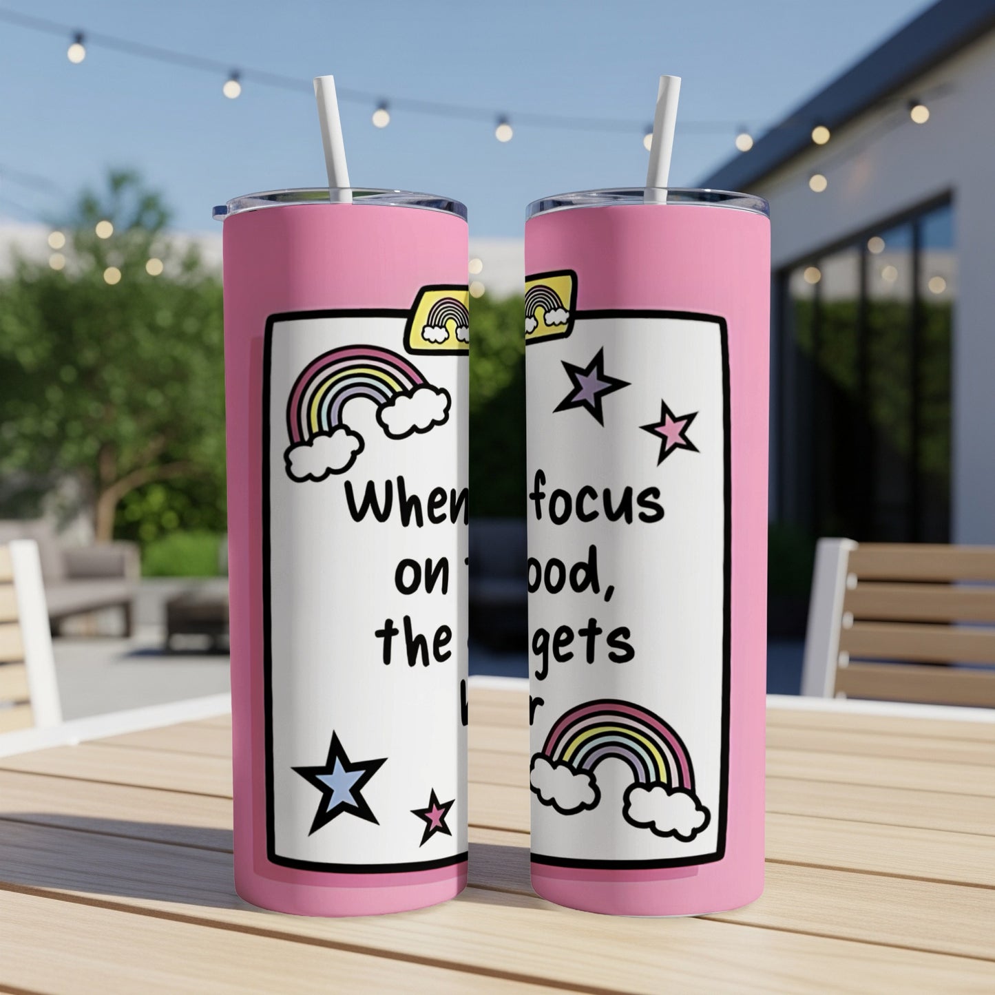 Pink tumbler with "When focus on food, the harder it gets" text and rainbow graphics.