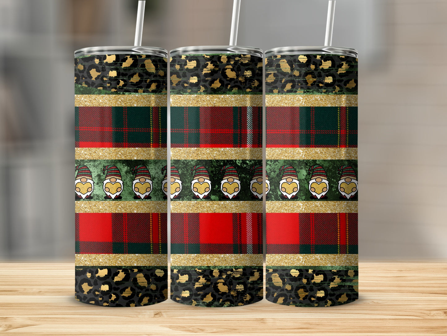 Three tall tumblers with plaid, leopard print, and gnome patterns.