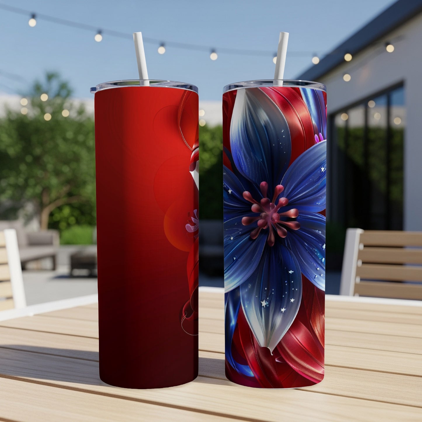 Two tumblers on a table, one with red swirls, one with a blue flower.