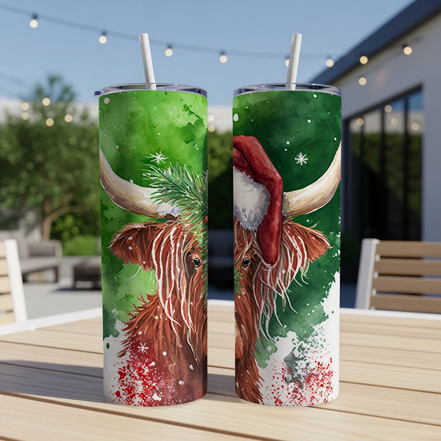Two tumblers featuring a watercolor Highland cow wearing a Santa hat.
