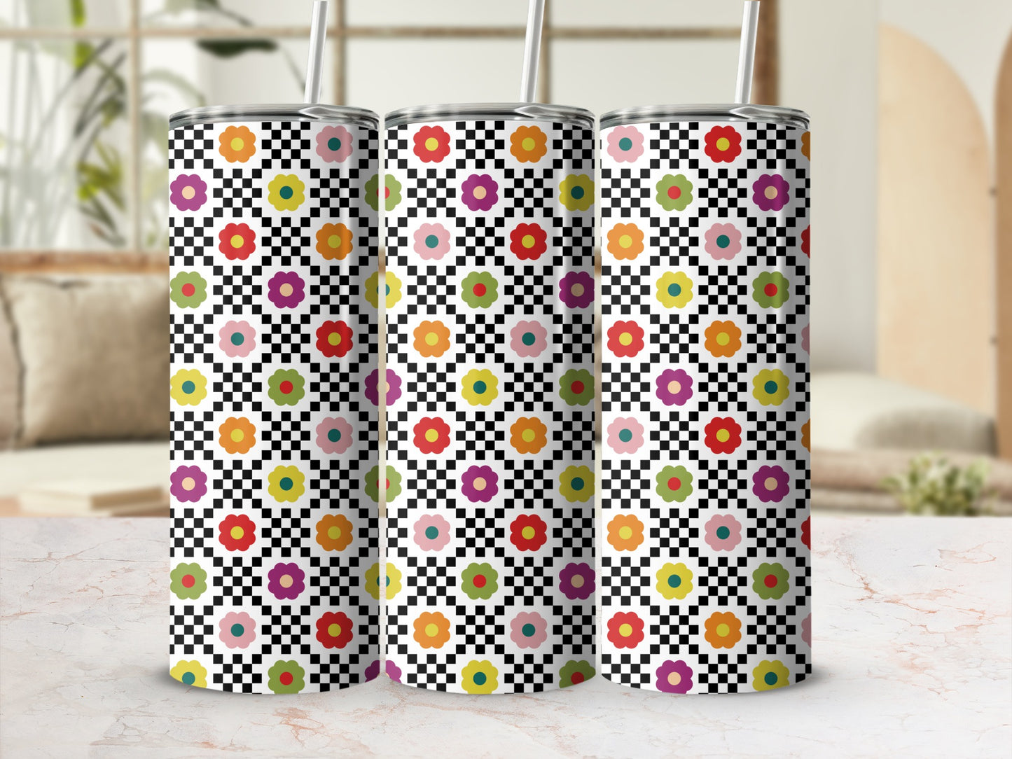 Three tumblers with checkered pattern and colorful floral design.