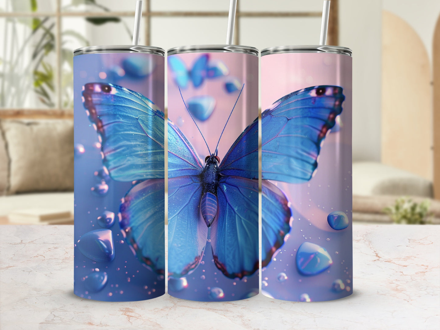 Blue butterfly design on three tumblers with water droplets.