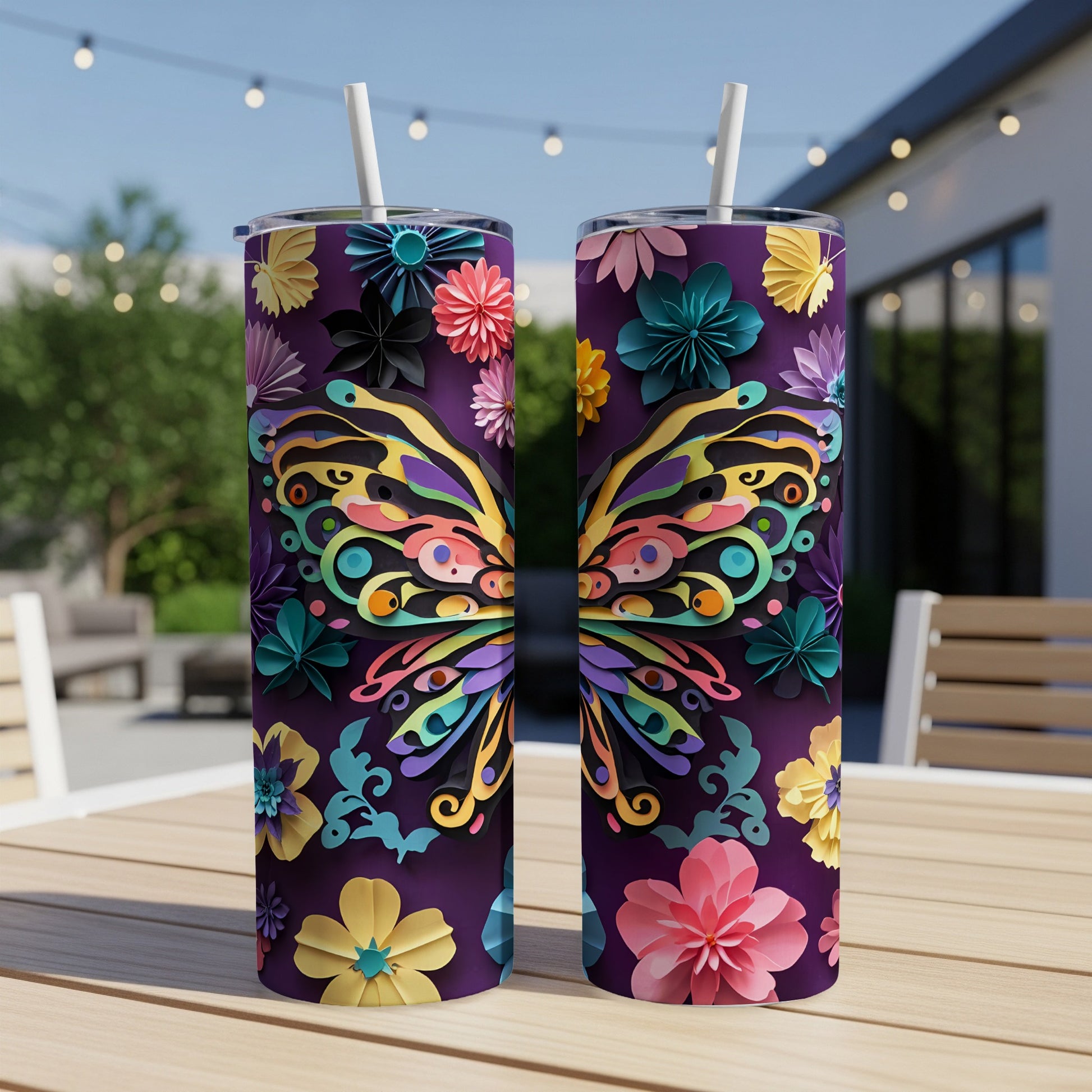 Two tumblers with a purple background decorated with colorful butterfly wings and floral designs.