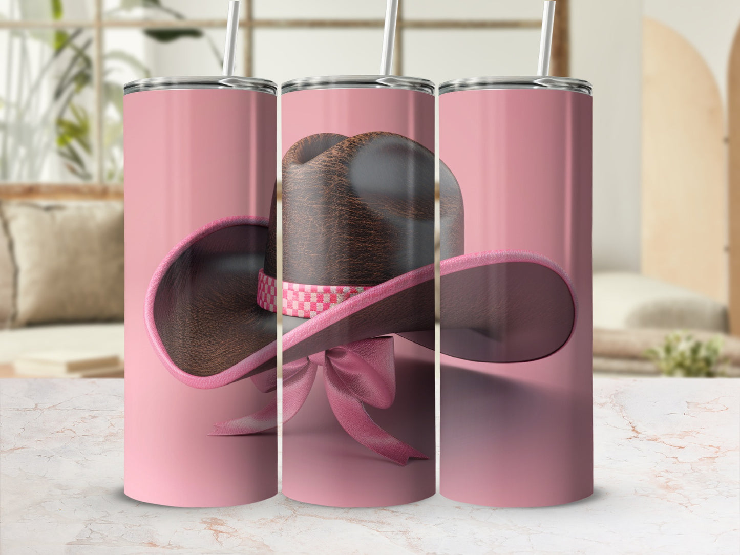 Pink tumbler with a cowboy hat and bow design.