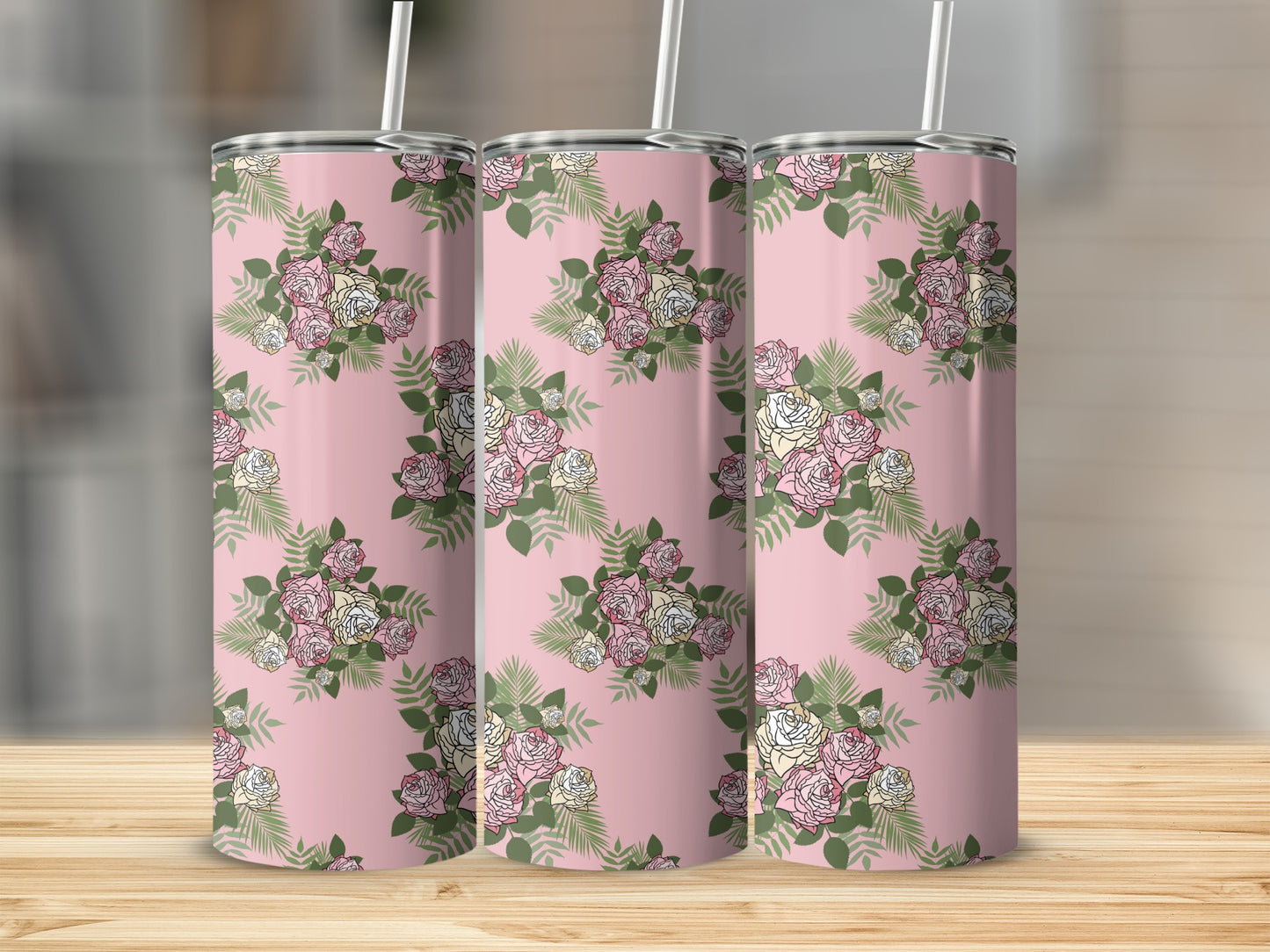Pink tumblers with a repeating floral pattern of roses and greenery.