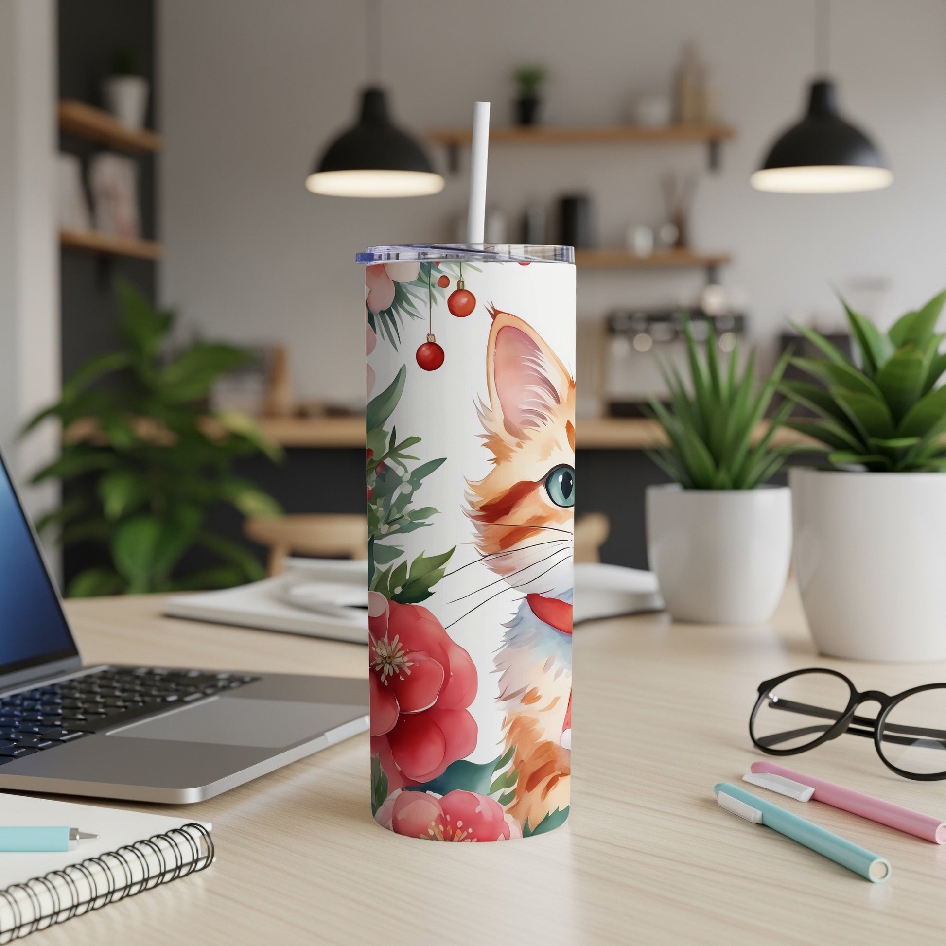 White tumbler with a watercolor cat and floral design, straw included.