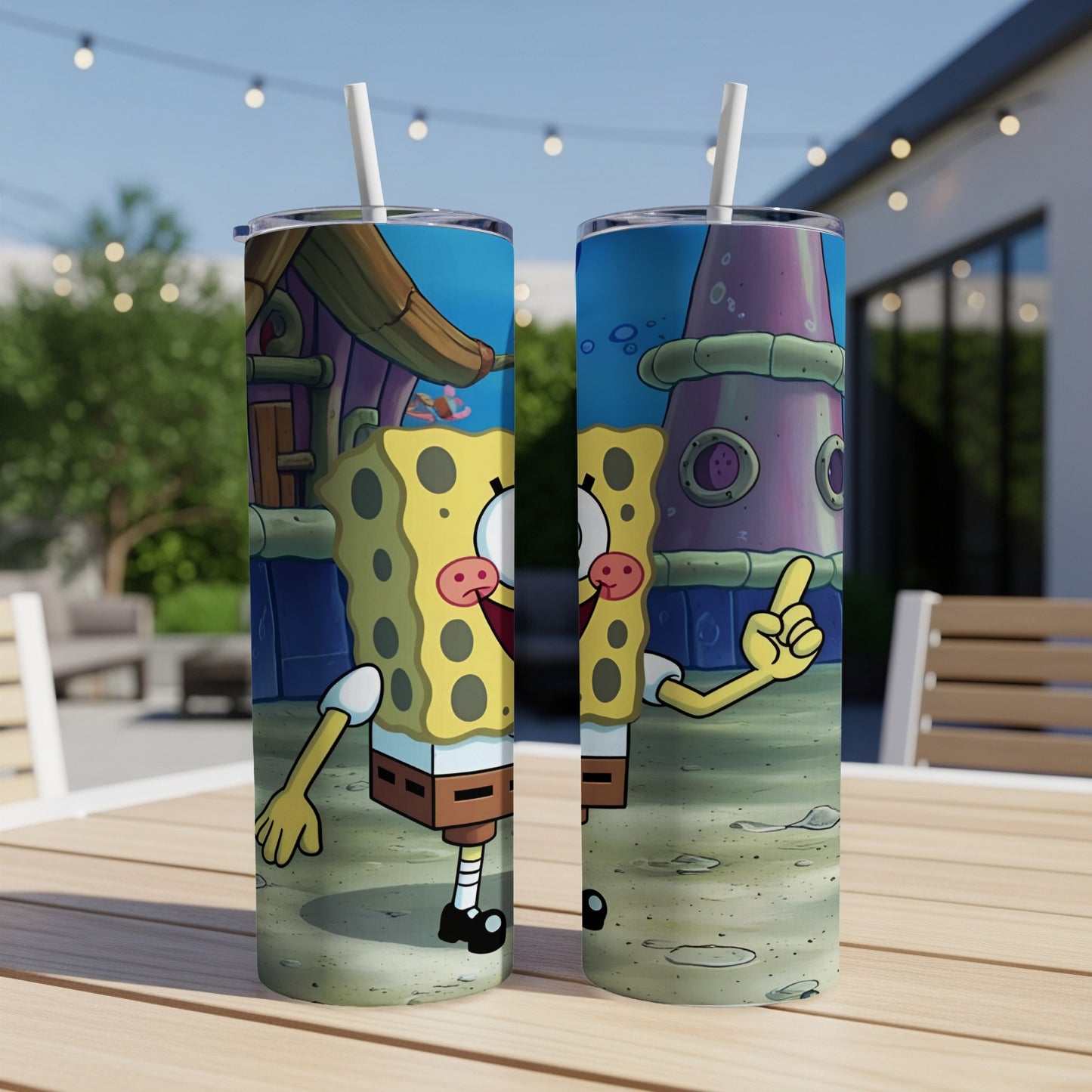 SpongeBob SquarePants artwork on two tall, cylindrical tumblers on a wooden table.
