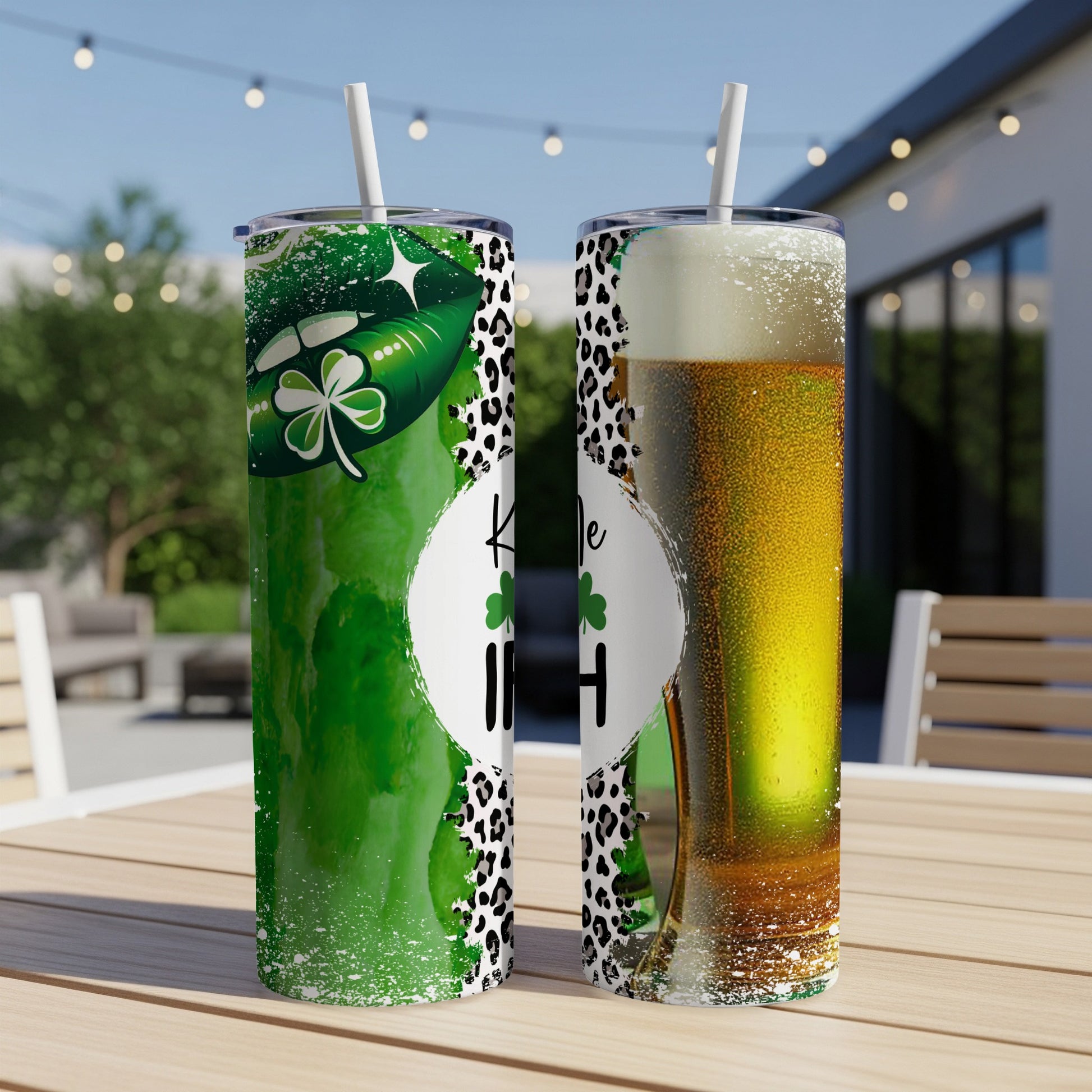 Two tumblers with St. Patrick's Day and beer designs on a wooden table.