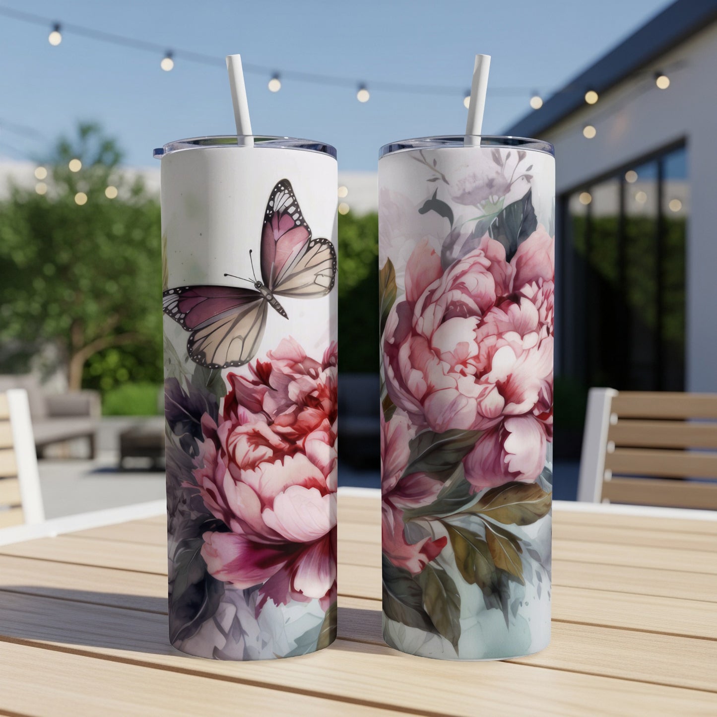Two tall tumblers with a pink floral and butterfly design.
