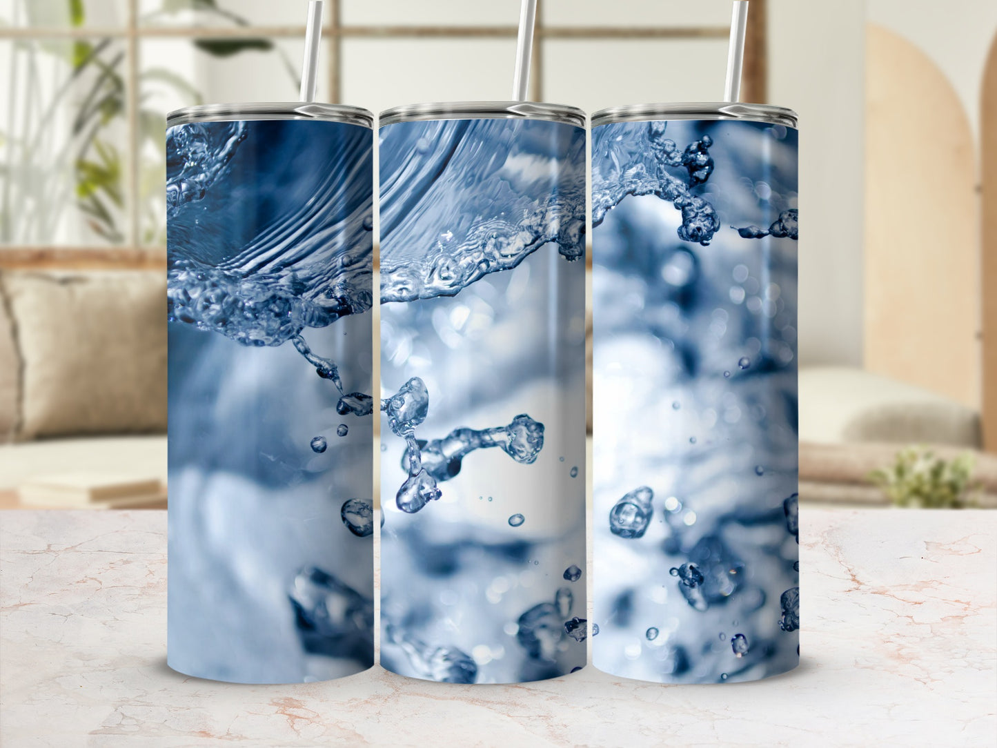 Three tumblers featuring a dynamic blue water splash design.