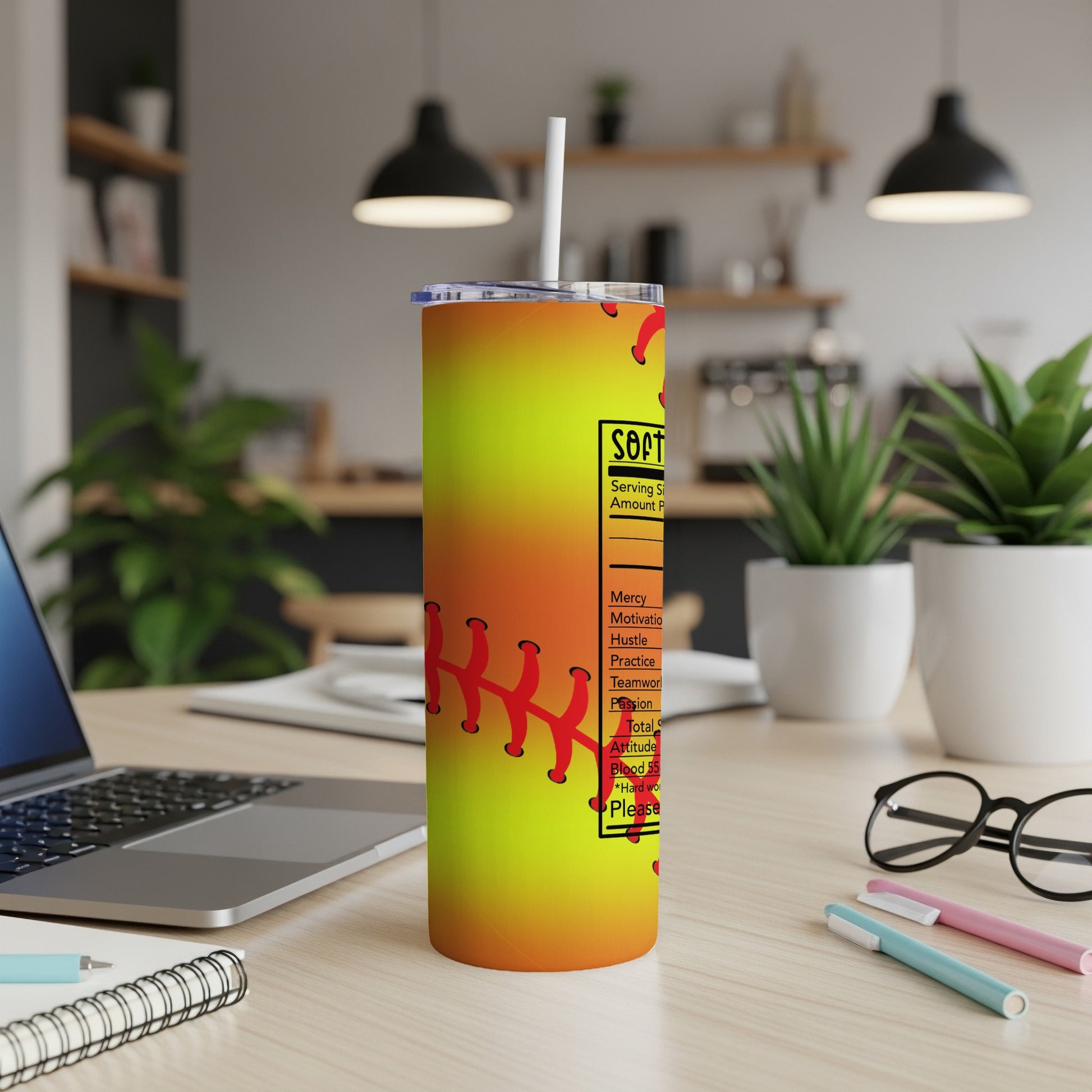 Softball nutrition facts tumbler with red stitching on a yellow-orange gradient.
