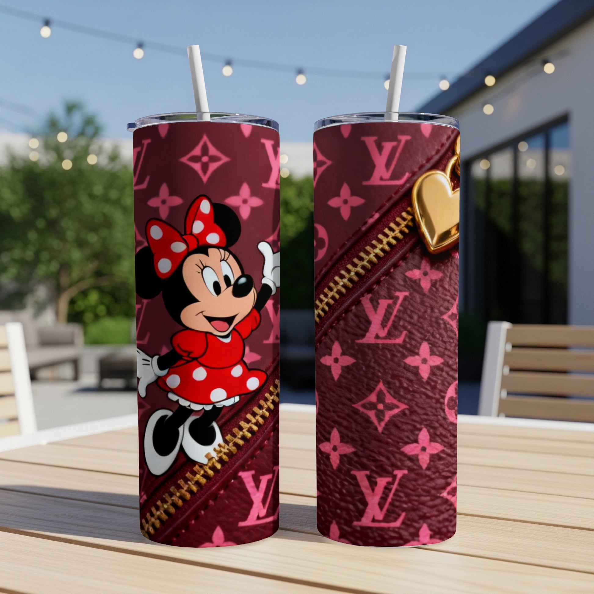 Minnie Mouse on a burgundy tumbler with LV print and gold zipper detail.
