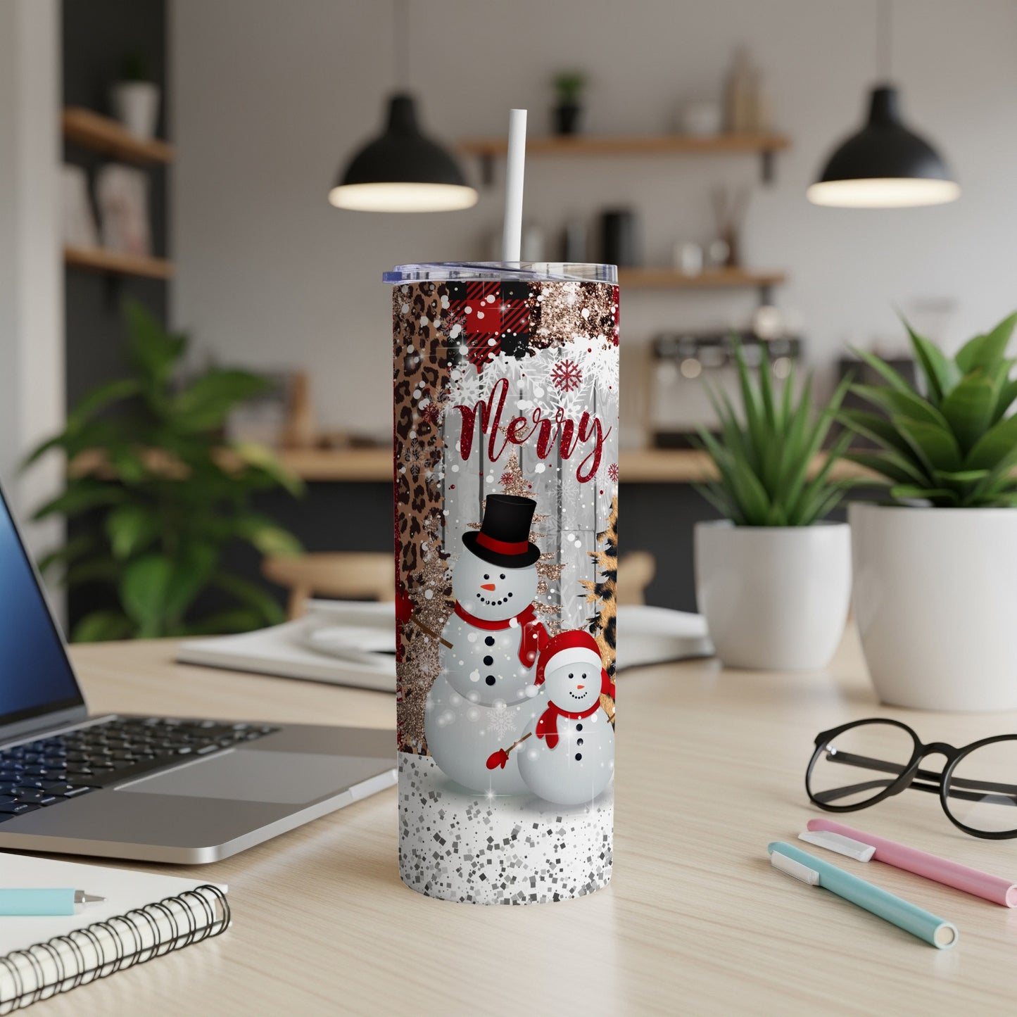 Snowman tumbler with "Merry" text and plaid accents.
