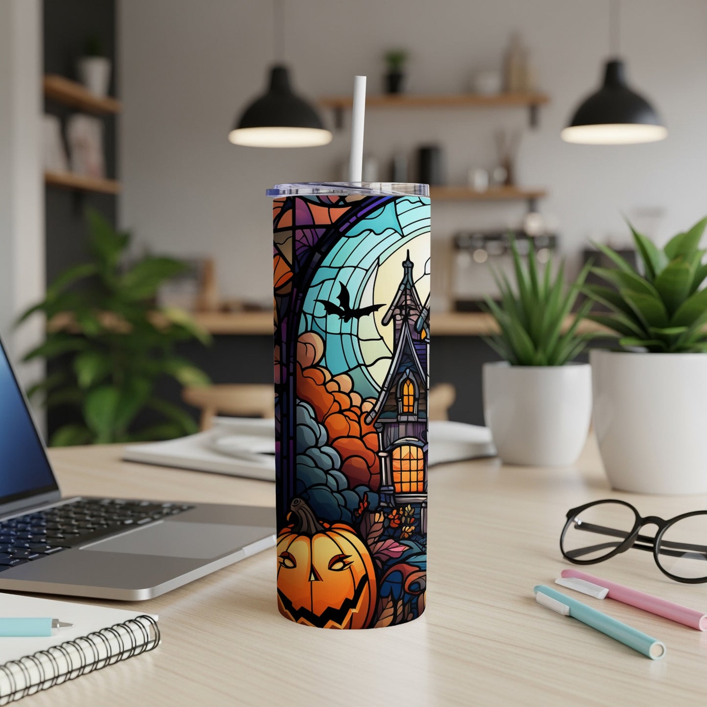 Halloween tumbler with haunted house, pumpkin, and stained glass design.