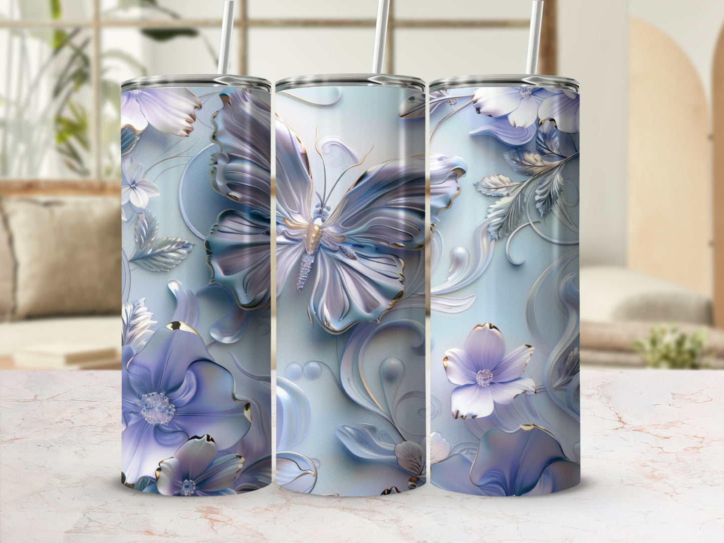 Three tumblers with floral and butterfly designs in blue and purple.