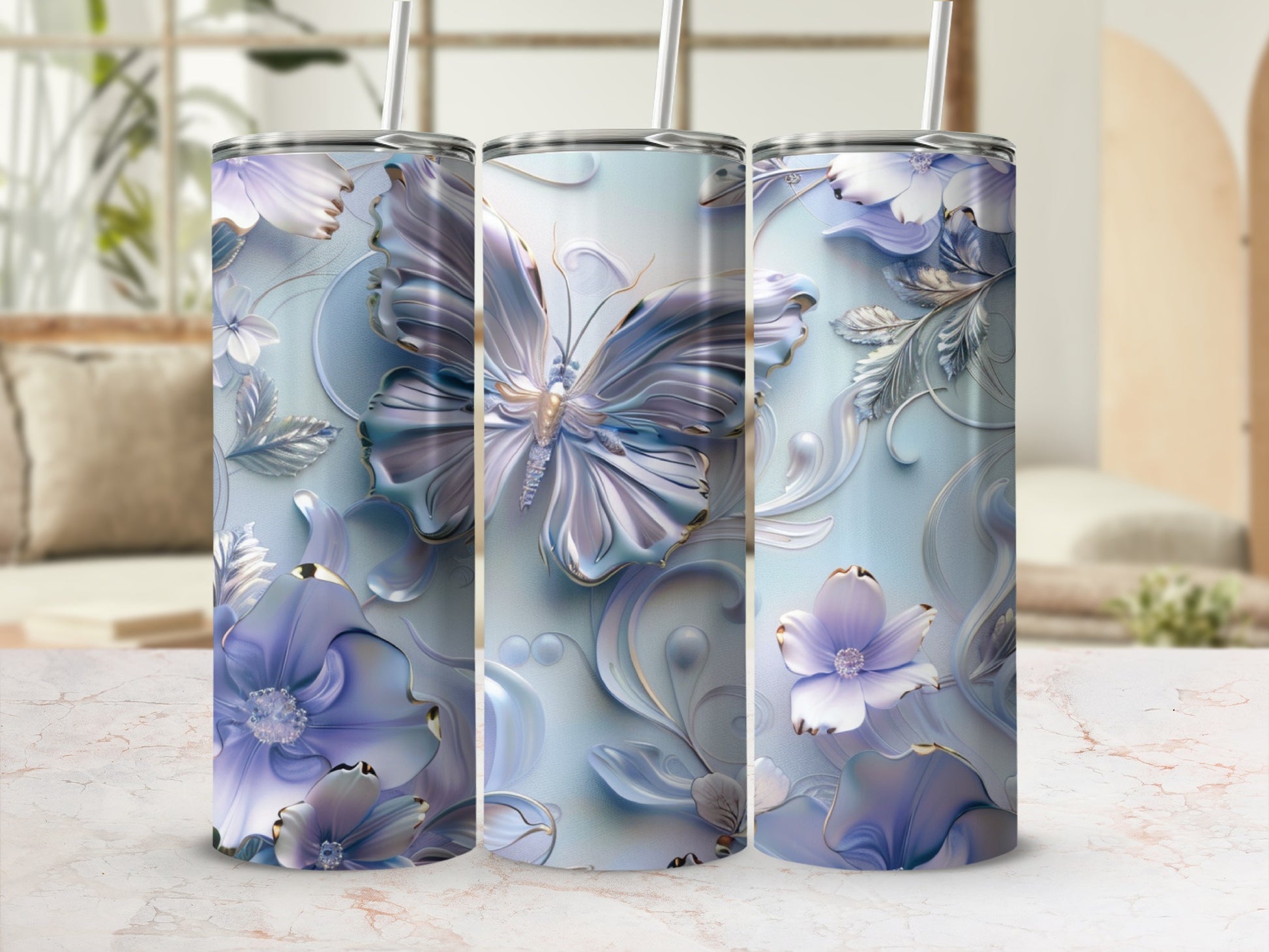 Three tumblers with floral and butterfly designs in blue and purple.
