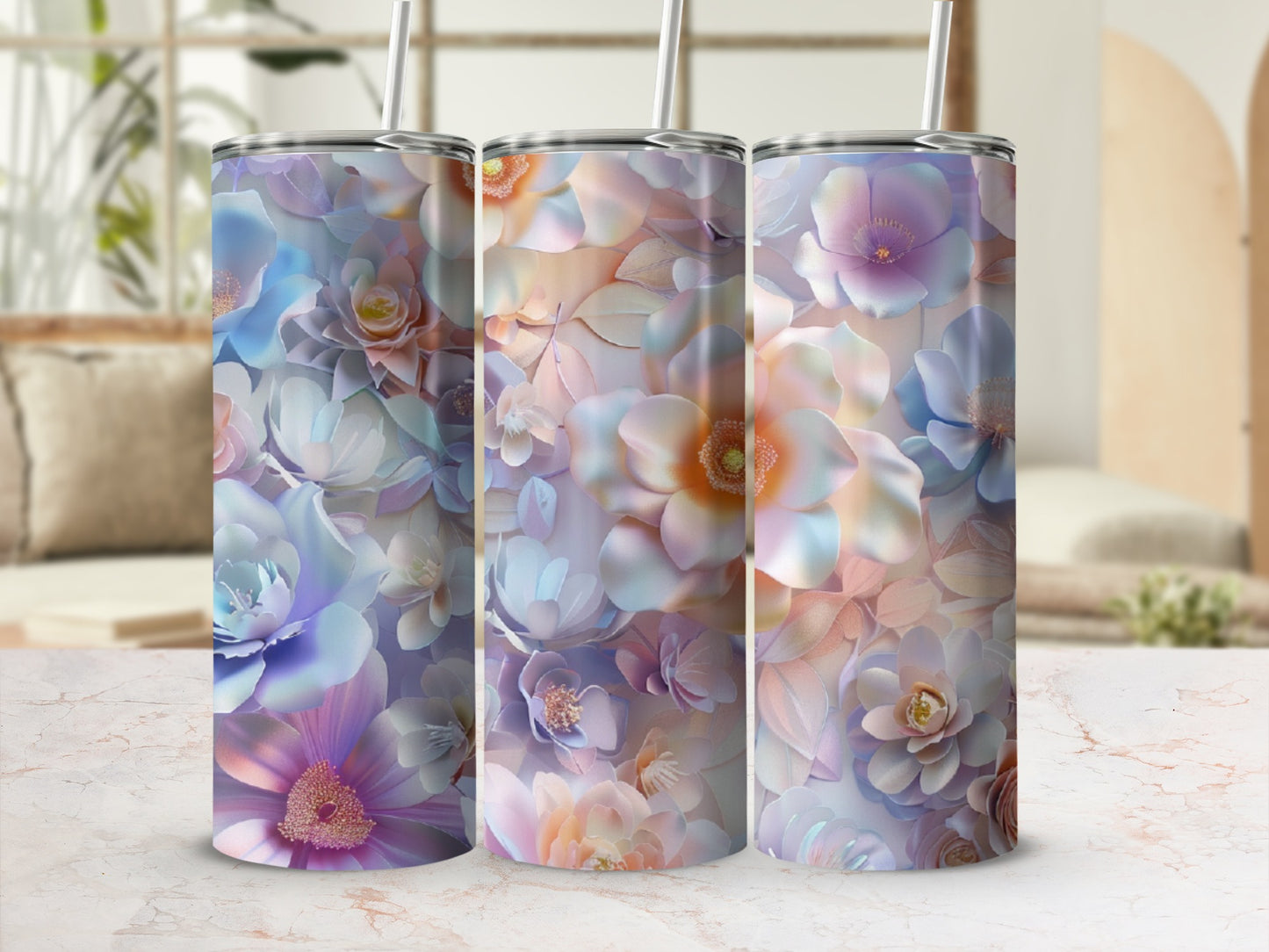 Three tumblers with floral watercolor designs in pastel shades.