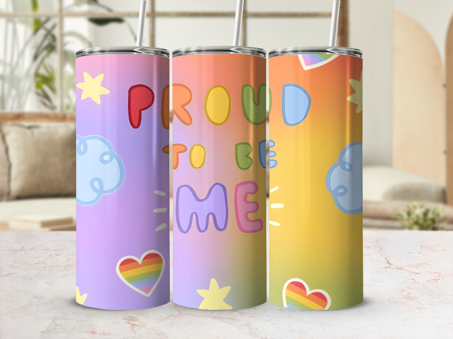 Rainbow tumbler with "Proud to Be Me" text and LGBTQ+ pride symbols.