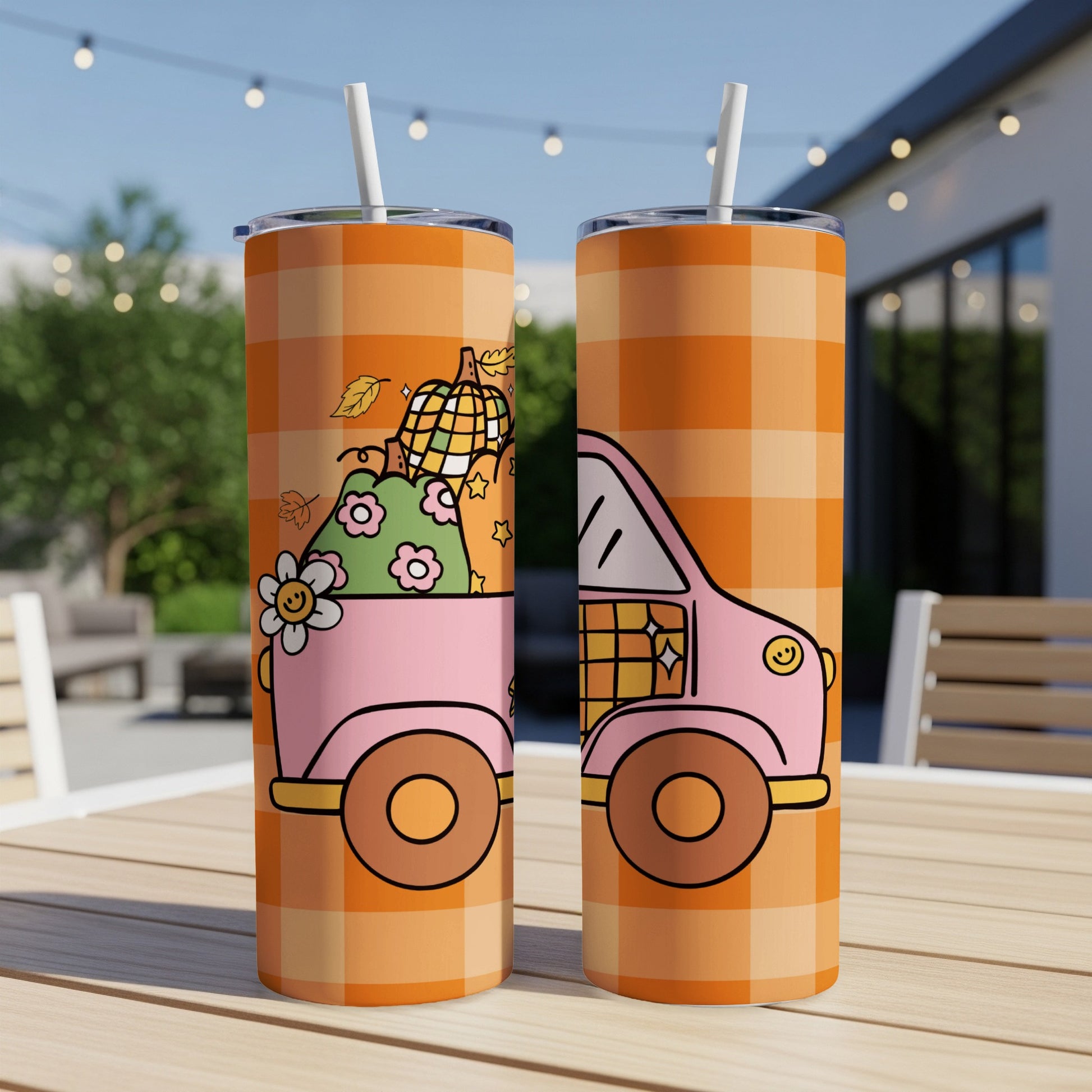 Pink truck with pumpkins and fall leaves, orange plaid tumbler.
