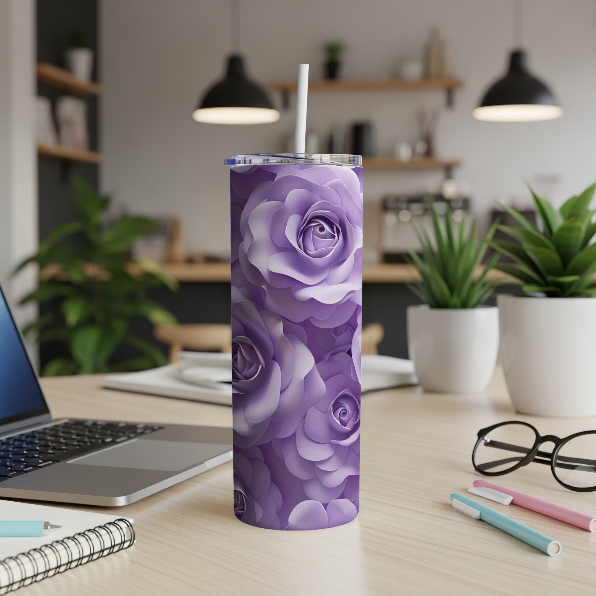 Purple floral pattern on a tall, slim tumbler with a straw.