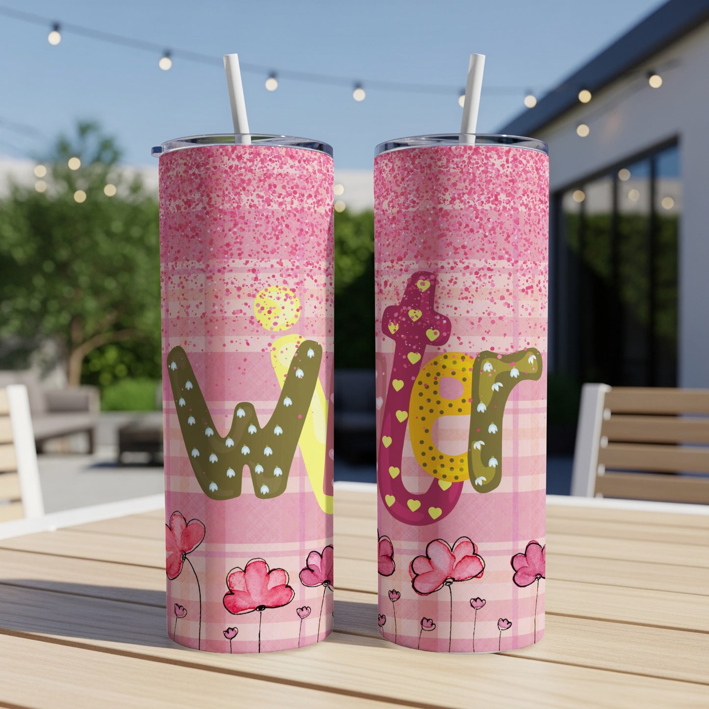 Two tumblers with "Easter" text and pink floral pattern on a table.