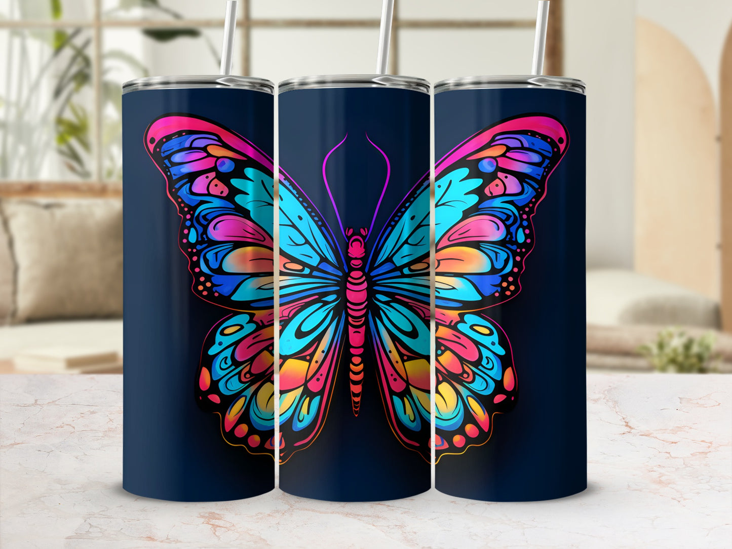 Three tumblers with a vibrant butterfly design.